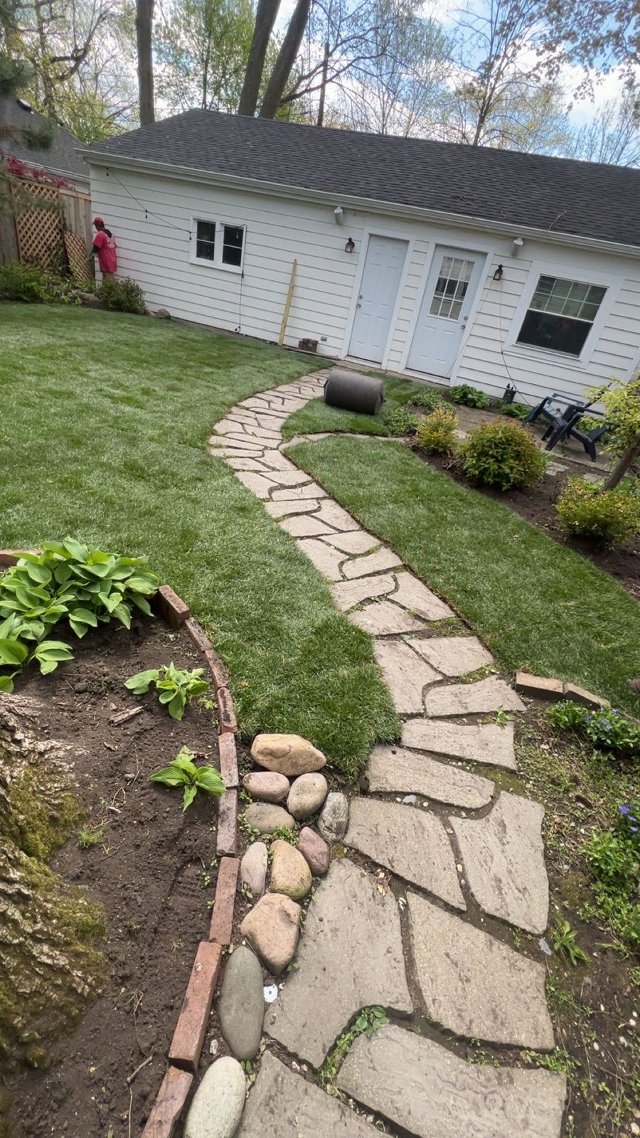 Natural flagstone walkway with fieldstone and boulder accents installed by MarioScape
